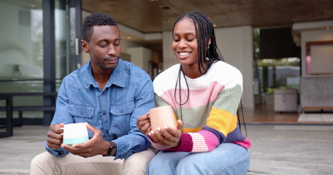 Smiling Couple Enjoying Coffee on Modern Patio