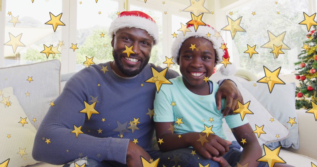 African American Father and Daughter Celebrating Christmas with Star Overlay - Free Images, Stock Photos and Pictures on Pikwizard.com