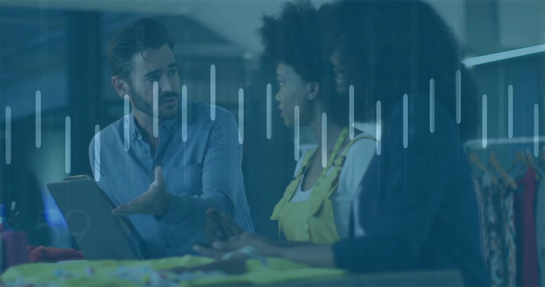 Consultant Discussing Fashion Samples with Women in Studio