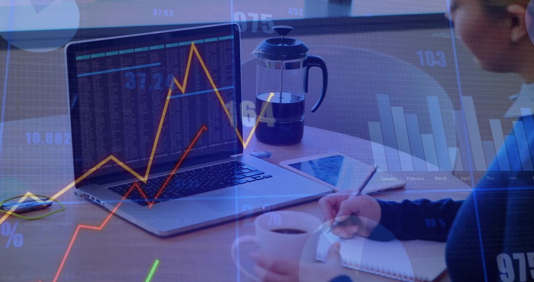 Analyzing Stock Market Trends with Laptop and Notes
