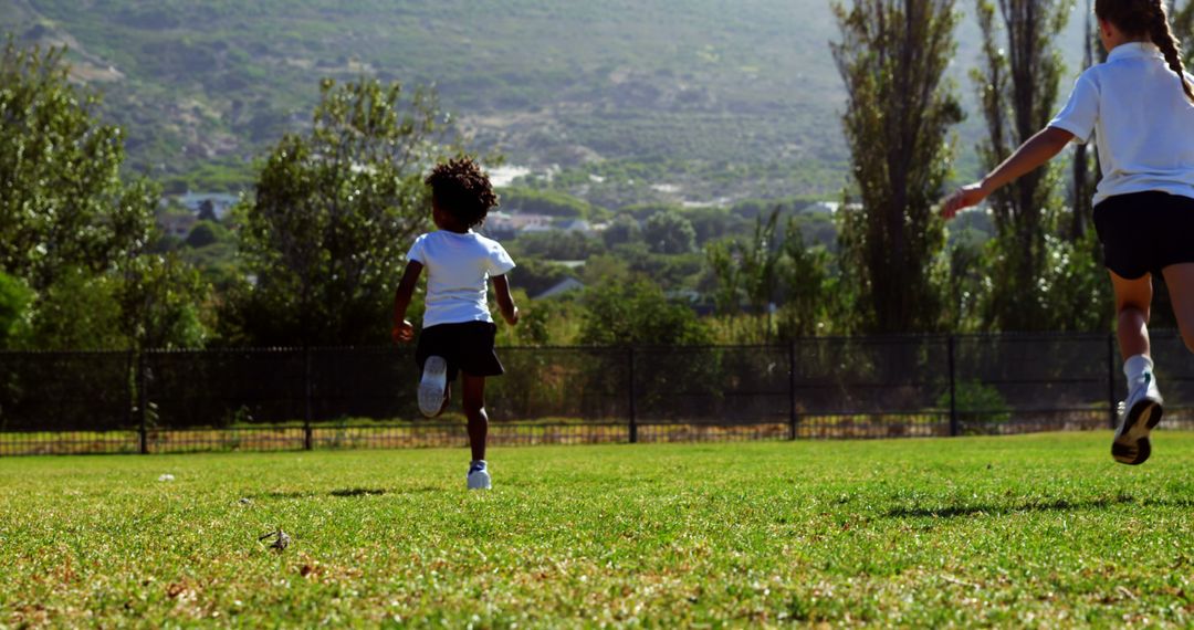 Children Running on Grass Field at Park - Free Images, Stock Photos and Pictures on Pikwizard.com