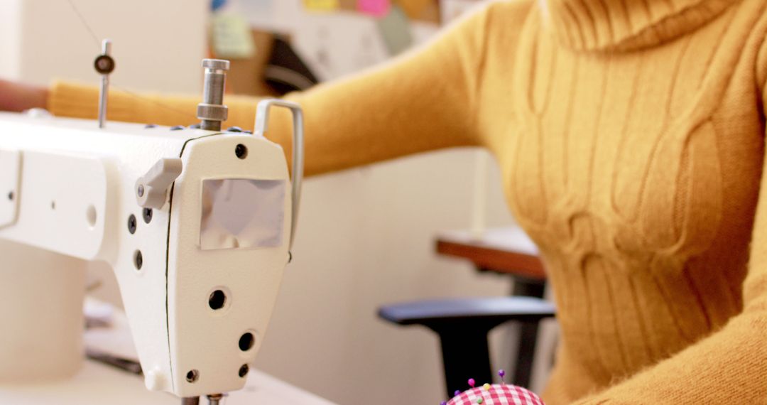 Fashion Designer Using Sewing Machine in Creative Workspace - Free Images, Stock Photos and Pictures on Pikwizard.com