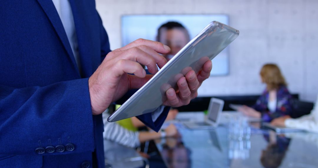 Business Professional Using Tablet in Conference Room Meeting