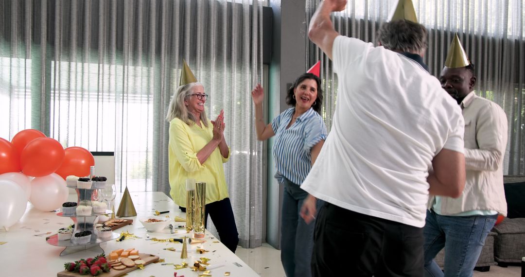 Diverse Colleagues Celebrating Joyful Office Party with Dancing
