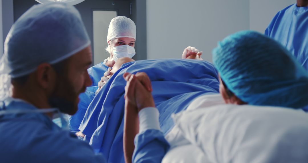 Caucasian female surgeon examining pregnant woman during labor in operation theater at hospital - Free Images, Stock Photos and Pictures on Pikwizard.com