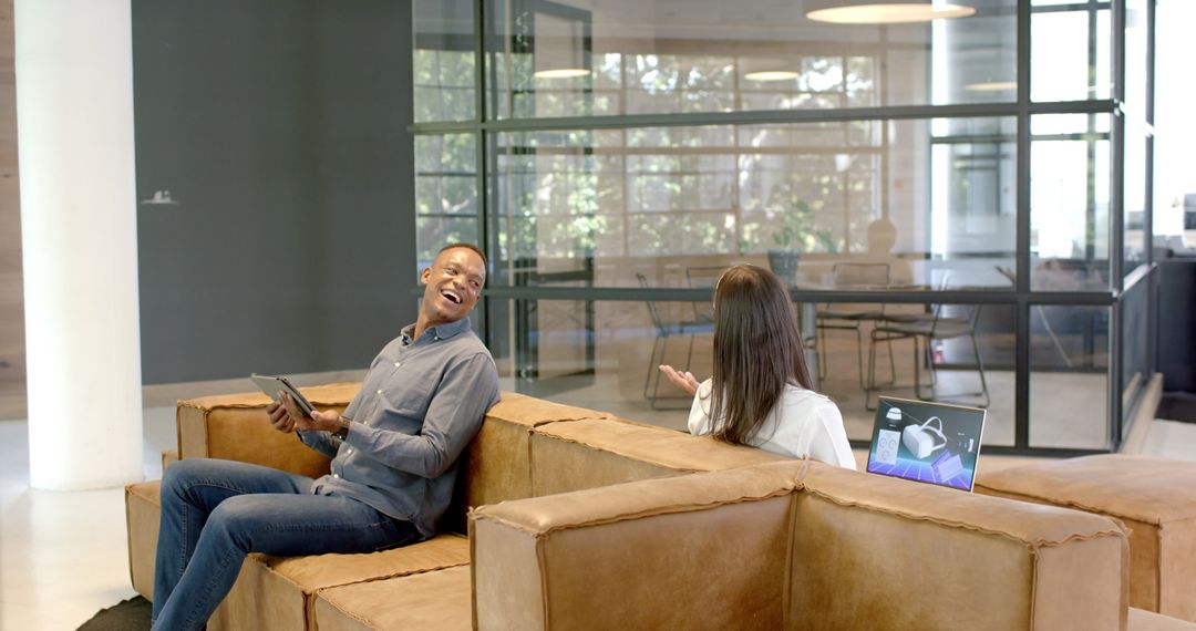 Colleagues Collaborating in Modern Open Office Layout