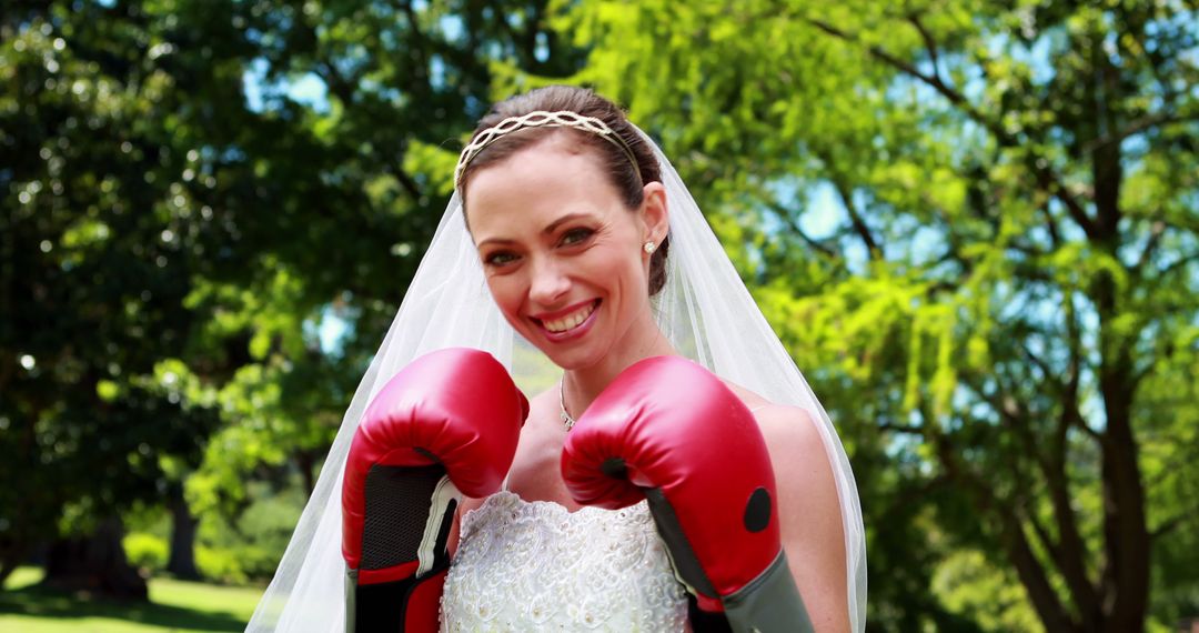 Smiling Bride Wearing Boxing Gloves Outdoors - Free Images, Stock Photos and Pictures on Pikwizard.com