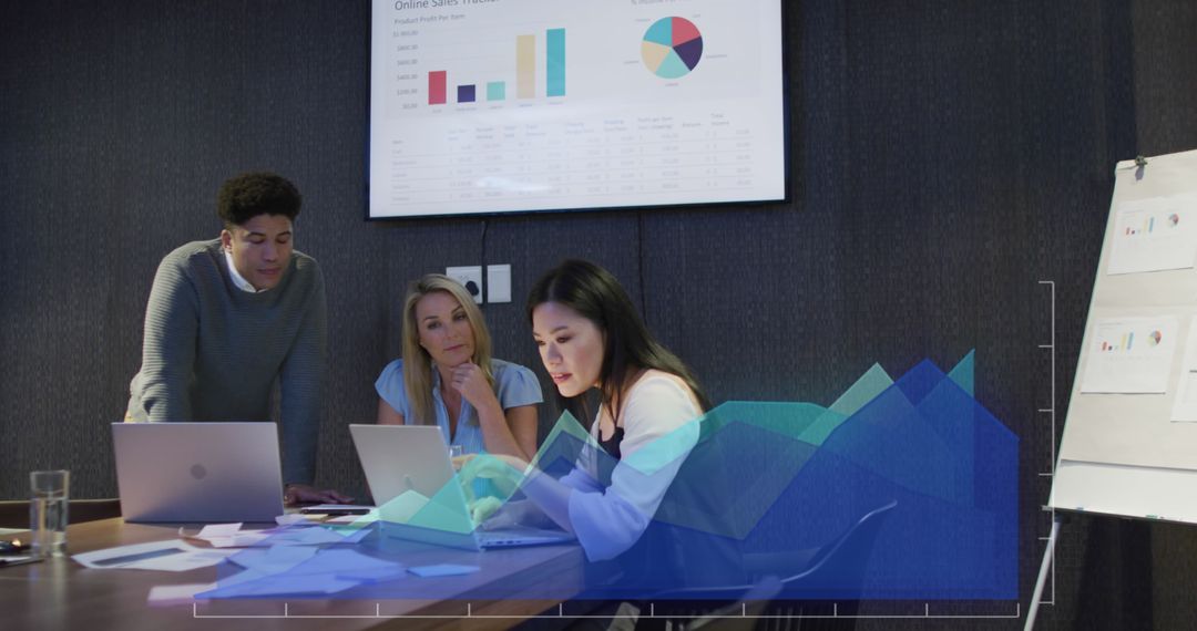 Diverse Business Team Analyzing Data with Graphs