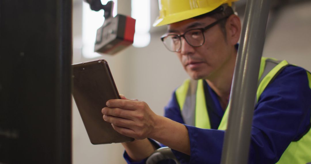 Industrial Engineer Using Tablet for Machinery Monitoring - Free Images, Stock Photos and Pictures on Pikwizard.com