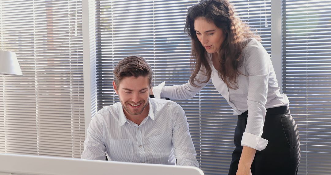 Colleagues Collaborating in Modern Office with Blinds - Free Images, Stock Photos and Pictures on Pikwizard.com