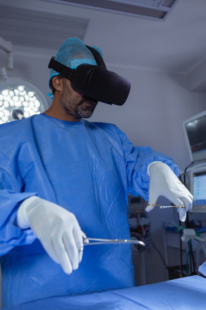 Male surgeon using virtual reality headset while practicing surgery in operation room at hospital - Free Images, Stock Photos and Pictures on Pikwizard.com