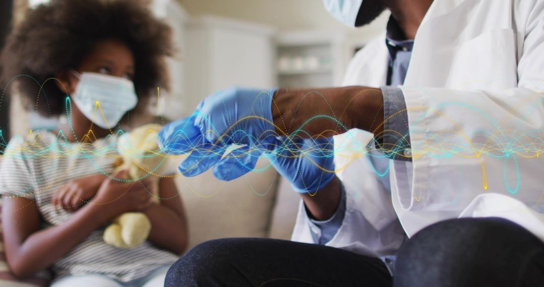 Pediatric clinician preparing vaccine on couch while child in mask holding teddy bear