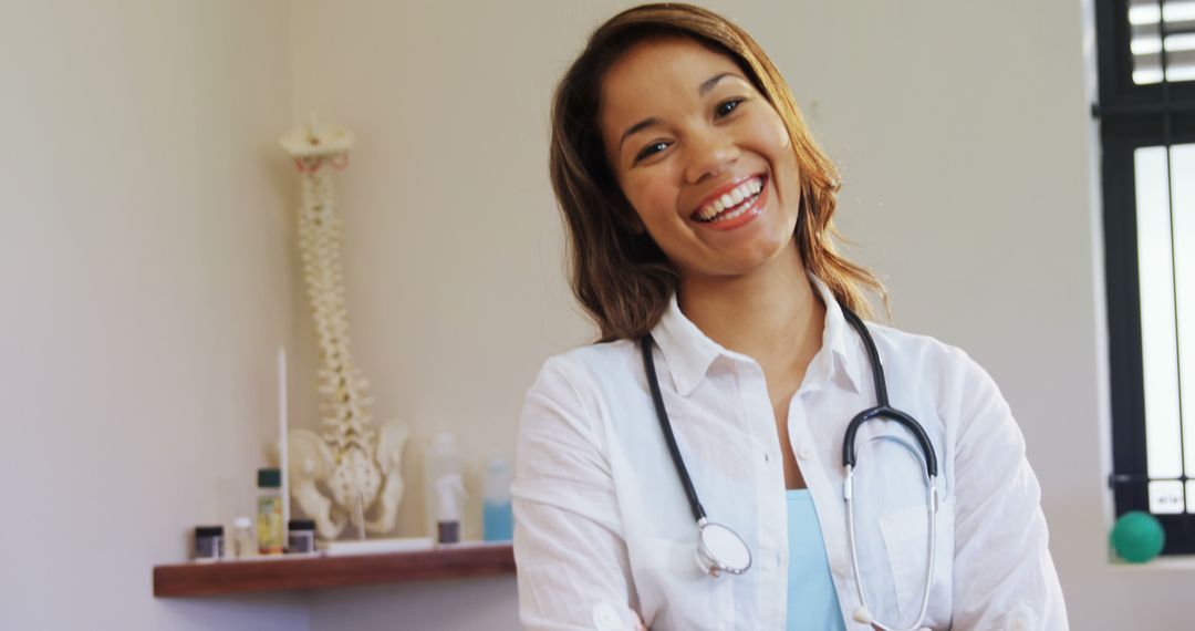 Smiling Female Doctor with Stethoscope in Medical Office - Free Images, Stock Photos and Pictures on Pikwizard.com