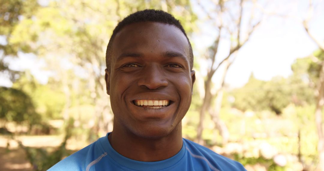 Smiling Man Enjoying Nature on a Sunny Day