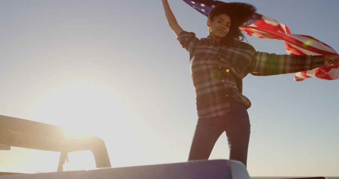 Carefree Woman with American Flag Waving in Wind at Sunset - Free Images, Stock Photos and Pictures on Pikwizard.com