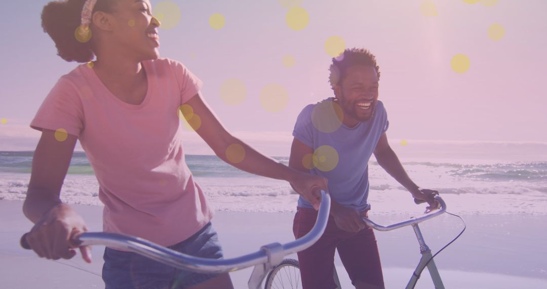 Smiling Couple Riding Bicycles on Sunny Beach Day