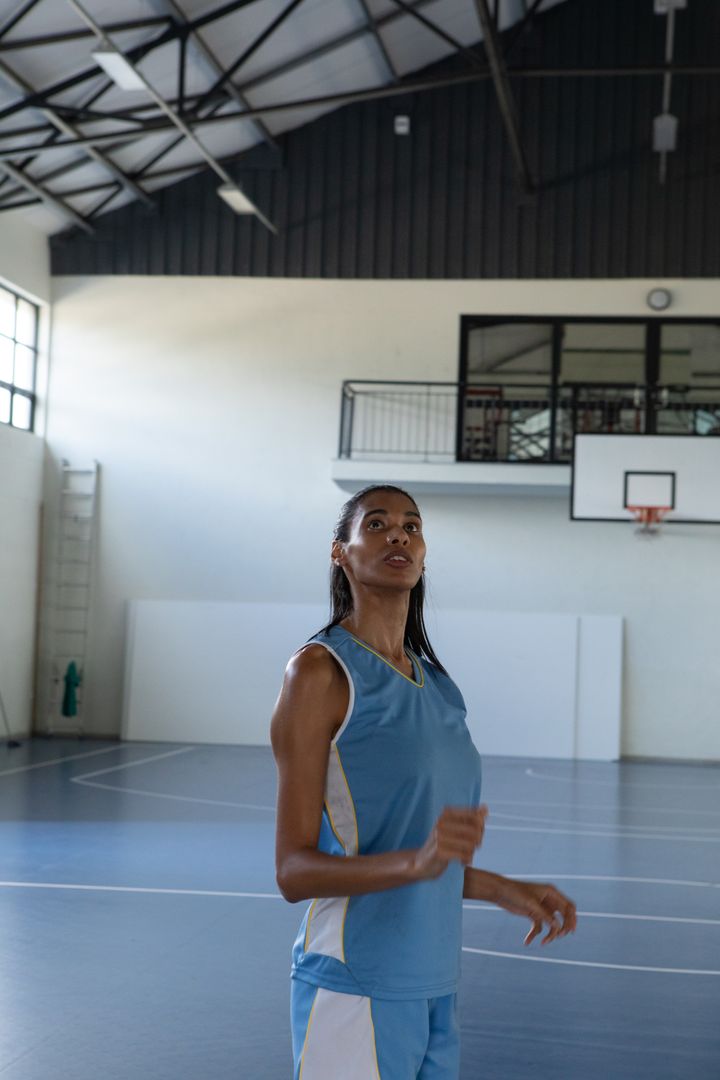 Female Basketball Player Practicing at Indoor Gym