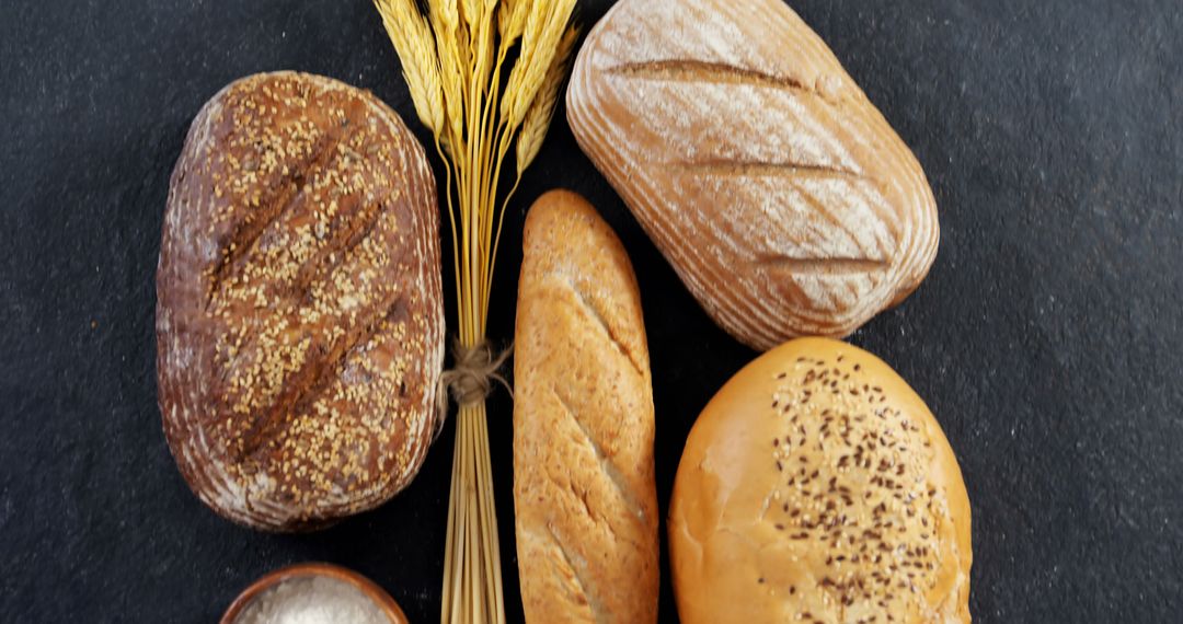 Assorted Freshly Baked Artisan Breads on Rustic Surface