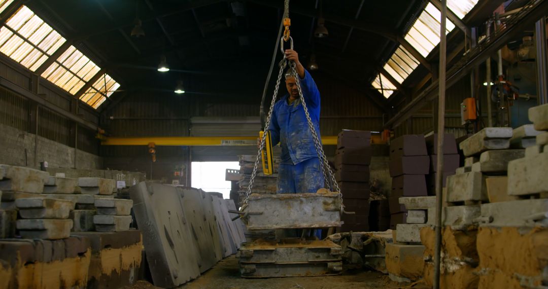 Worker Operating Heavy Machinery in Industrial Warehouse - Free Images, Stock Photos and Pictures on Pikwizard.com