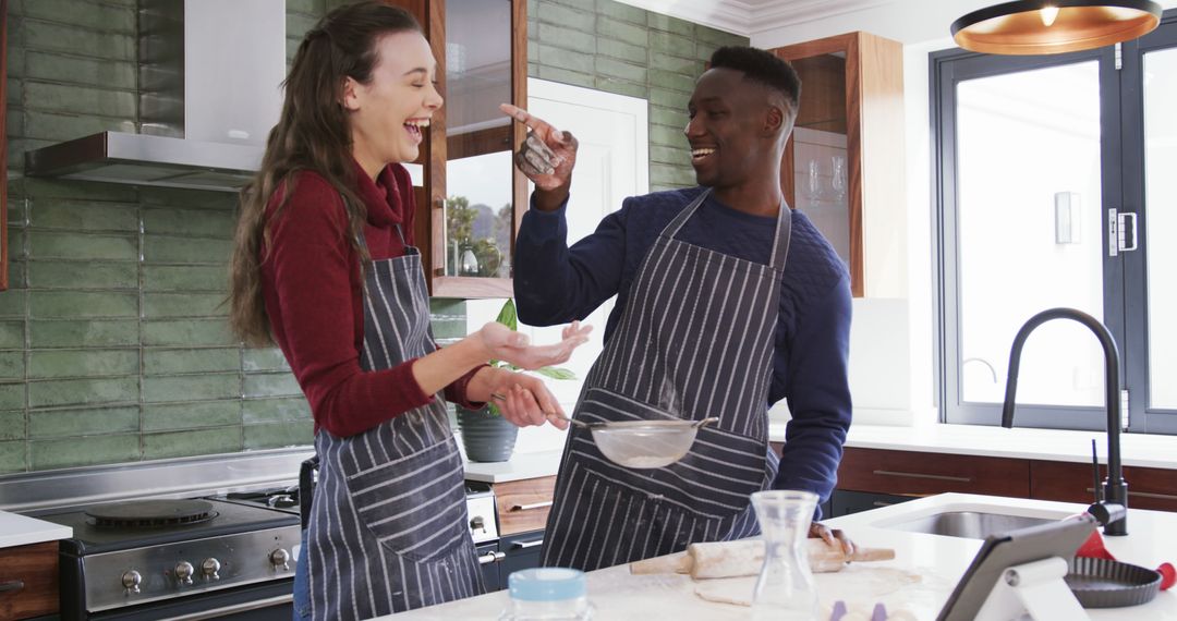 Interracial Couple Baking Together in Modern Kitchen - Free Images, Stock Photos and Pictures on Pikwizard.com