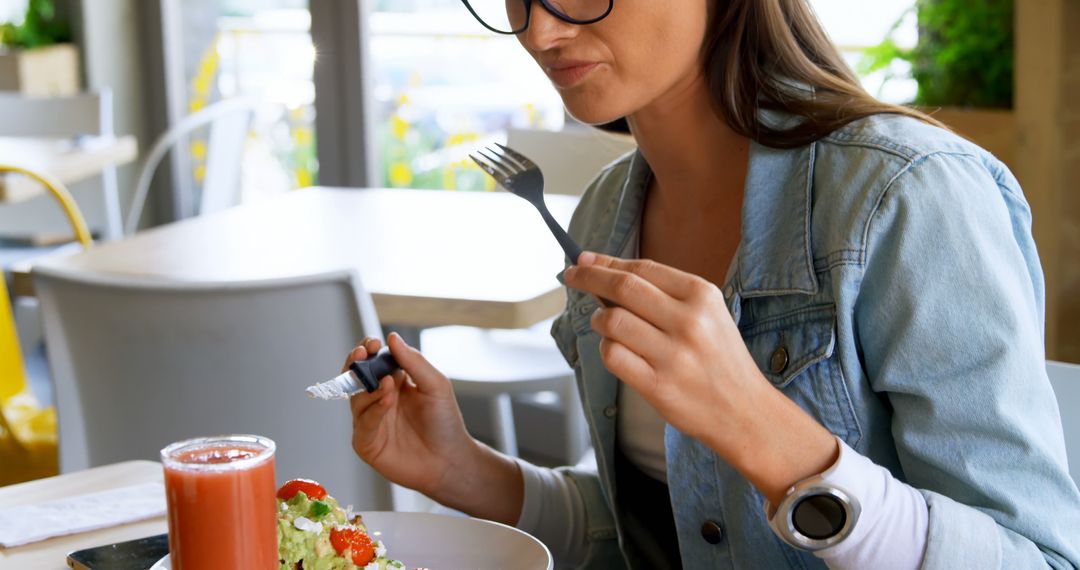 Woman Eating Healthy Salad in Modern Cafe - Free Images, Stock Photos and Pictures on Pikwizard.com