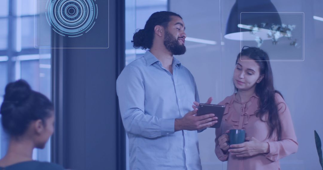 Colleagues Discussing Digital Technology Innovations in Modern Office