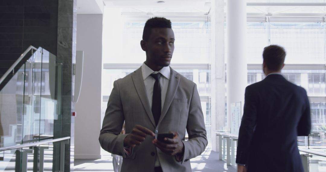 Elegant Business Professional Walking Through Office Lobby