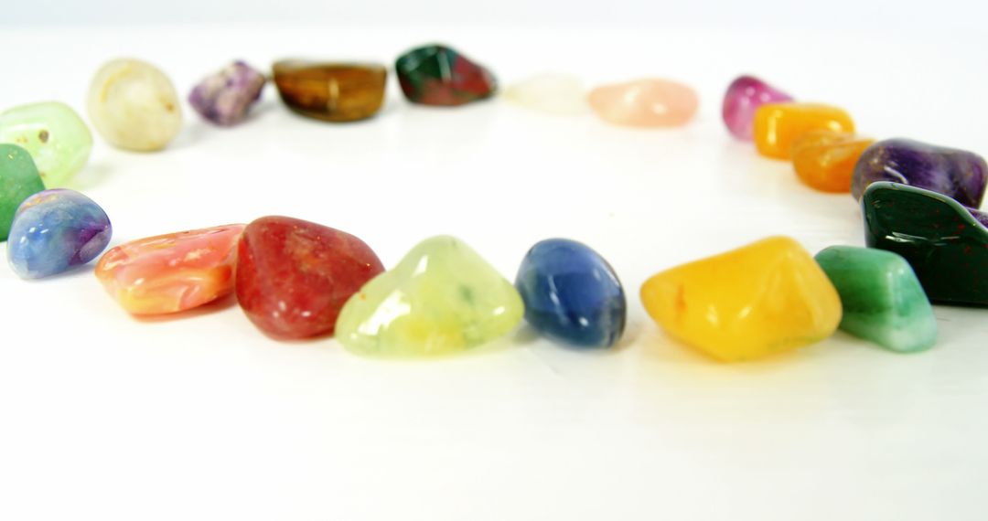 Colorful Polished Stones Arranged in Circle on White Background - Free Images, Stock Photos and Pictures on Pikwizard.com