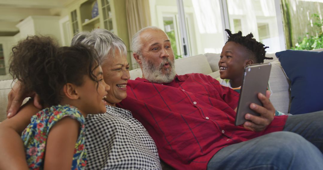 Grandparents Enjoying Video Call with Grandchildren on Tablet - Free Images, Stock Photos and Pictures on Pikwizard.com