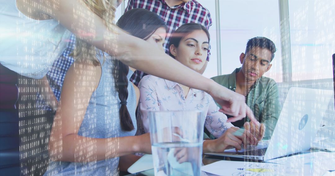 Diverse Team Collaborating on Laptop with Digital Interface Overlay
