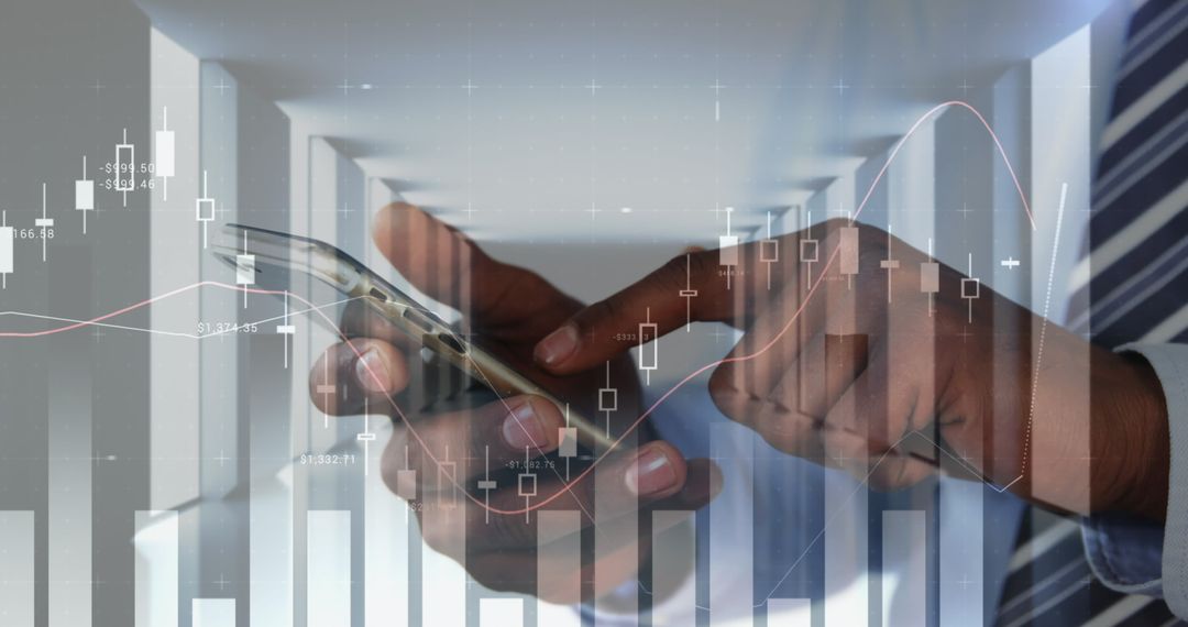Hands Interacting with Smartphone and Digital Financial Charts