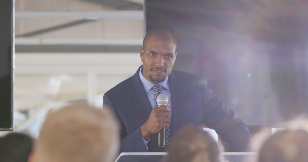 Confident African American Man Giving a Speech at Business Seminar - Free Images, Stock Photos and Pictures on Pikwizard.com