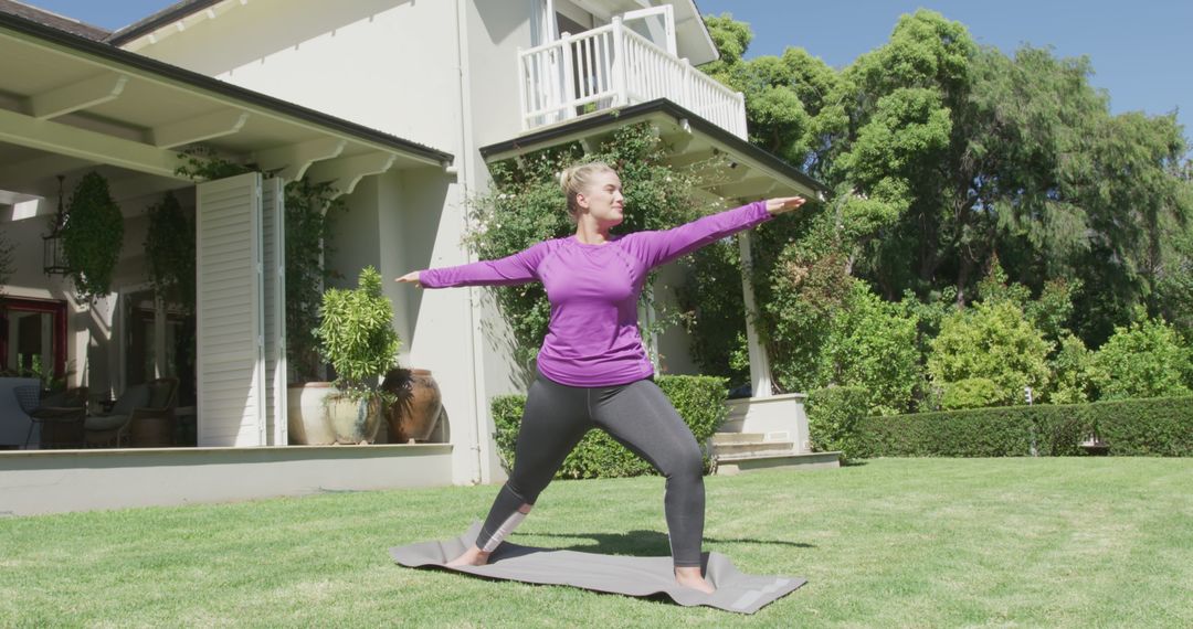 Woman Doing Yoga Outdoors in Warrior II Pose - Free Images, Stock Photos and Pictures on Pikwizard.com