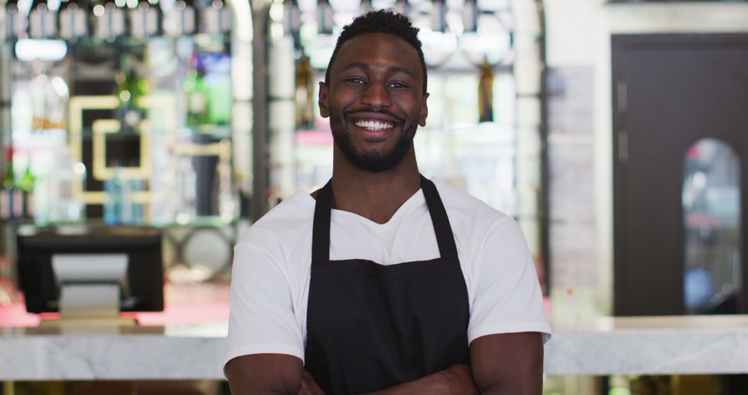 Confident Barista Smiling at Cafe Counter