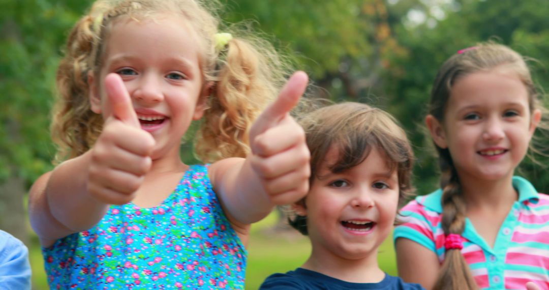 Happy Children Giving Thumbs Up Outdoors - Free Images, Stock Photos and Pictures on Pikwizard.com