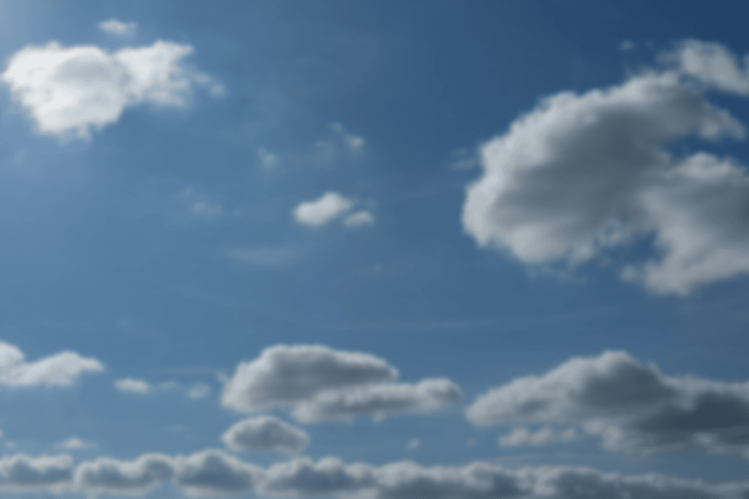 Blue Sky with White Fluffy Clouds on Transparent Background