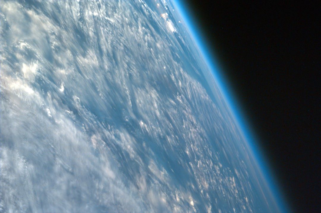 Earth's Atmosphere from Space with Cloudy Surface - Free Images, Stock Photos and Pictures on Pikwizard.com