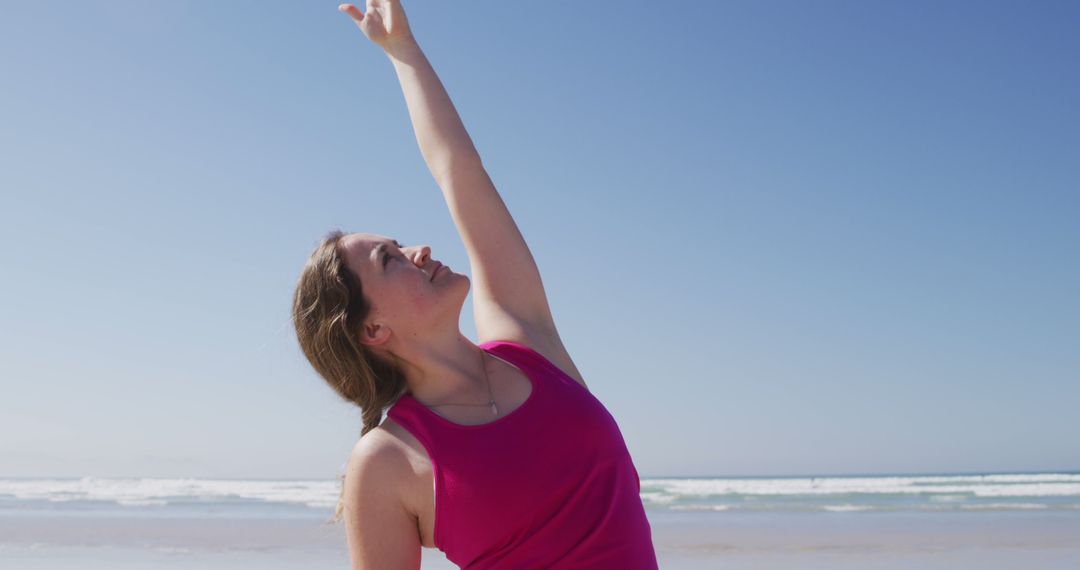 Woman Stretching at Beach on Sunny Day - Free Images, Stock Photos and Pictures on Pikwizard.com