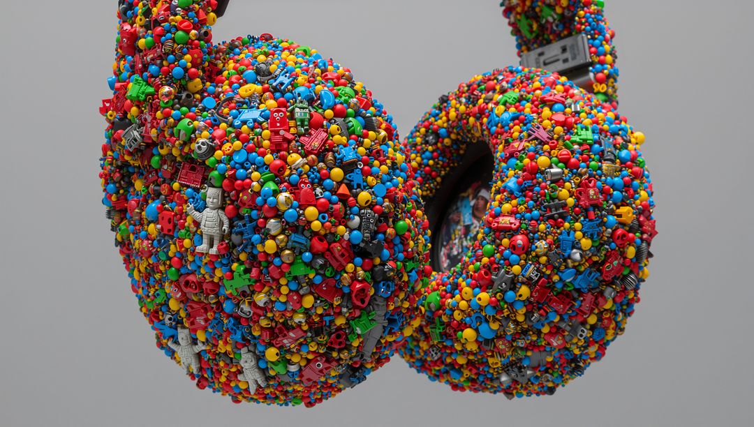 Upcycled Over-Ear Headphones Sculpture Featuring Colorful Toy Robots, Beads, Studs