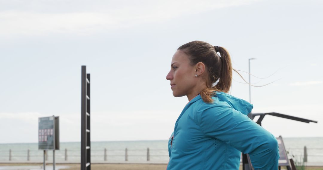 Focused Female Athlete Training Outdoors by the Beach - Free Images, Stock Photos and Pictures on Pikwizard.com