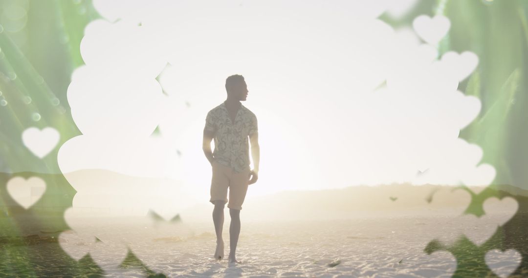 Man Walking on Beach at Sunset Surrounded by Heart Silhouettes