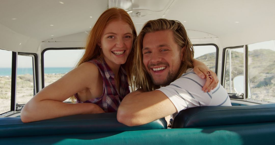 Young Couple Smiling Inside a Retro Camper Van by the Beach - Free Images, Stock Photos and Pictures on Pikwizard.com