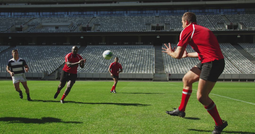 Rugby Players Passing Ball in Stadium - Free Images, Stock Photos and Pictures on Pikwizard.com