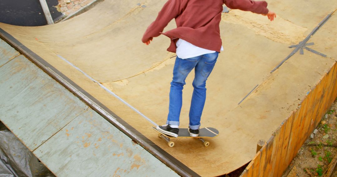 Teenager Skateboarding on Half Pipe Outdoor Ramp - Free Images, Stock Photos and Pictures on Pikwizard.com