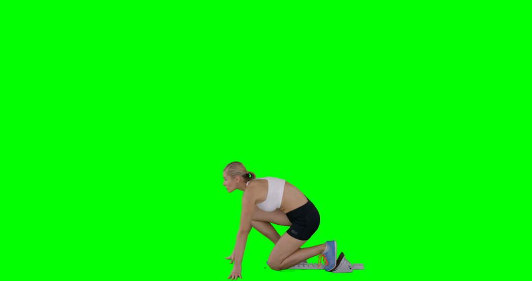 Female Athlete in Starting Block Pose Against Green Screen - Free Images, Stock Photos and Pictures on Pikwizard.com