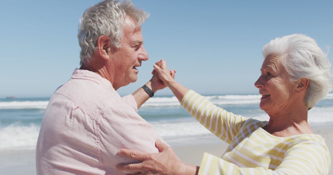 Senior Couple Dancing and Smiling on Beach - Free Images, Stock Photos and Pictures on Pikwizard.com