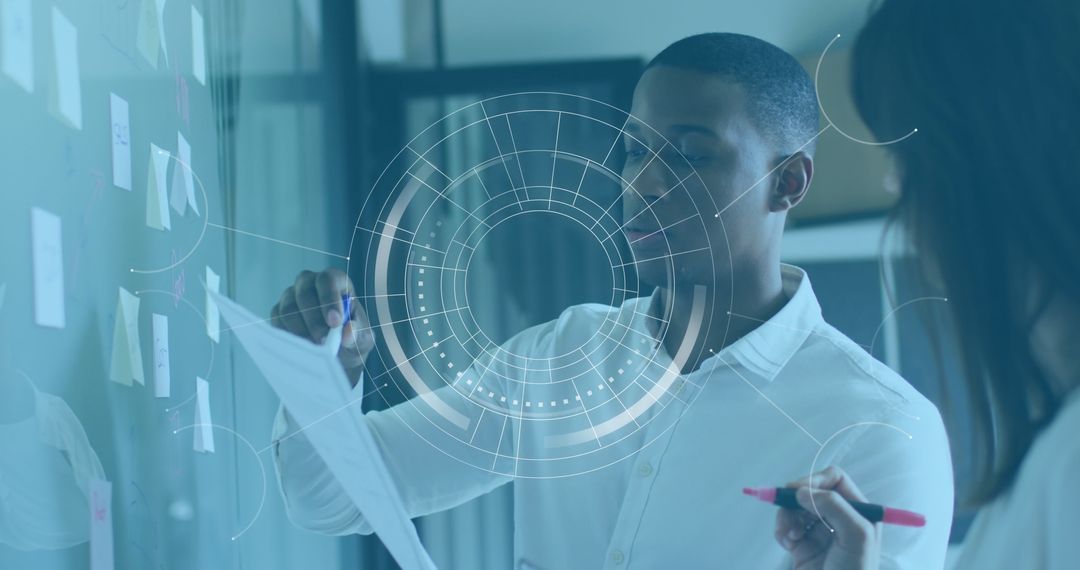 Multicultural Team Analyzing Business Strategies with Charts