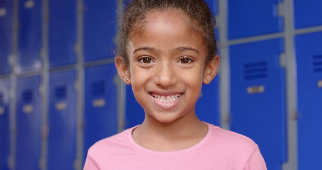 Smiling Student in Hallway with School Lockers Background
