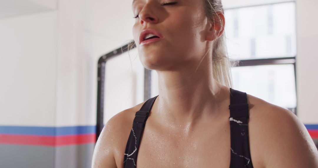 Determined Woman Taking a Breath During Workout - Free Images, Stock Photos and Pictures on Pikwizard.com