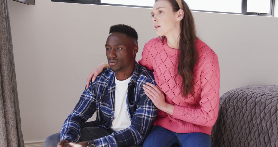 Diverse Couple Comforting Each Other in Domestic Scene